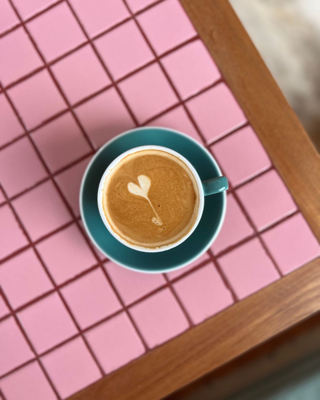 pink table with cup of coffee